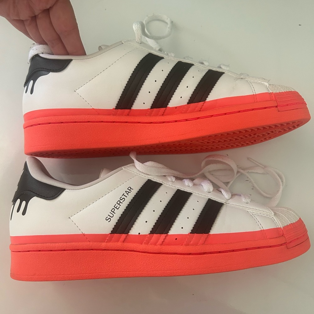 Adidas Superstar White and Black with orange Soles. Size 7. Gently worn.